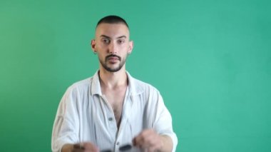 Handsome man wearing glasses, cool man wearing sunglasses, young man in white shirt wearing sunglasses to stay fashionable, isolated image of the model in front of the green screen