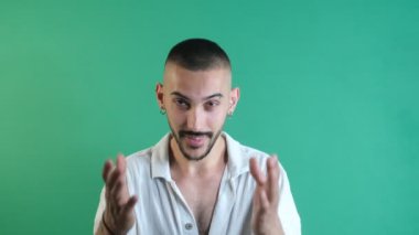 Invitation facial expressions, male model making a come with me sign, making a come sign with both hands, emotions and facial expressions of the model in front of the green screen