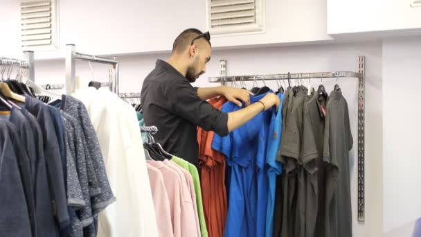 Young Man Who Chooses What Likes Colorful Shirts Aisle Buy — Video