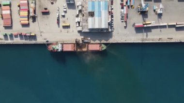 Aerial drone view of Famagusta city port, anchorage of cargo ship, colored containers in the port, city ports for maritime trade in TRNC