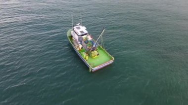 Drone view of boats advancing to fish in the sea, fishing boats on the lake, fishing season, hunting with seanets