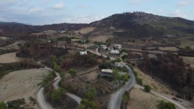 Drone view of the destruction after forest fire, view of ash trees, blackened forest and village, Destruction and settlements after the forest fire in Manavgat