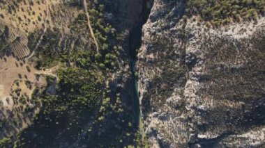 Drone view of the valley between the mountains, the wonder of natural formation with a stream passing through it