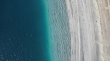 Aerial drone footage of volcanic lake salda, famous crater lake salda with water waves and white beach, tectonic lake regions in Turkey