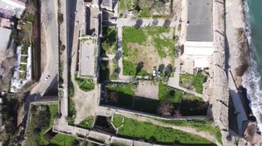 Inside the walls of the historical castle built by the sea, Kyrenia castle taken by drone from the air, Girne protected by the castle walls