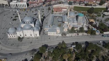 Drone view of historical places of konya from the air, drone view of sultan selim mosque and Mevlana museum, cityscapes with historical buildings side by side