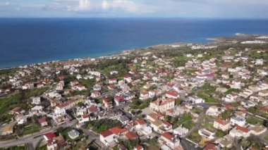 Aerial drone view of the natural beauty of cyprus, the settlement of the city in nature, the buildings and trees in the island city
