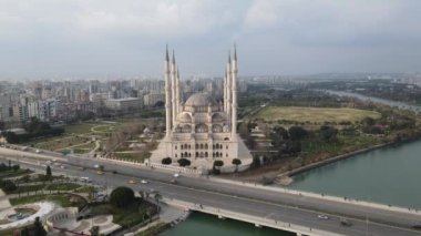 View of Sabanci Mosque, the largest mosque of the island, drone view of the mosque built by the river, Islamic place of worship, magnificent mosques