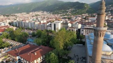 Drone grand mosque of bursa, drone view of historical mosque in bursa city, architectural structure of islamic place of worship with minarets and domes