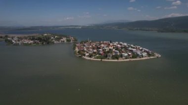 Drone view village in lake, village in the lake drone view, living area built into the lake, touristic resorts of turkey, summer holiday destinations with different construction