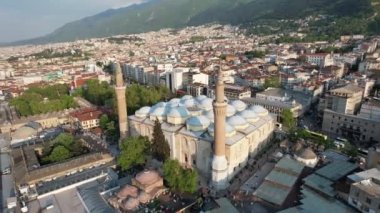 Historical Ottoman Mosque, drone image of inner city settlement of historical ottoman mosque, Bursa mosque famous for its minaret and domes