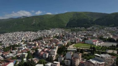 Drone footage of bursa city, Bursa view of the ottoman city built at the foot of the green mountain, apartment and building layout view of the city
