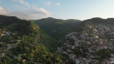 Green valley city bursa, cityscape between valleys of green mountains, building settlements on mountain slopes, drone view of bursa city between green valleys