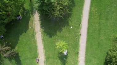 Aerial botanical park, botanical park covered with green grass and trees, green places to exercise on the weekend walkways