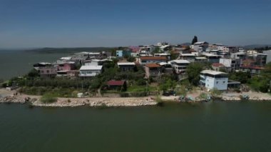 Golyazi district drone view, settlement image of touristic golyazi city, living area built into the lake, touristic resorts of turkey, summer holiday destinations with different construction