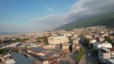 Aerial grand mosque of bursa, bursa great mosque square and its surroundings drone view, urban settlement with historical buildings