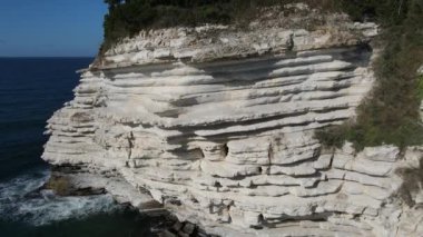 Abyss of white stones, image of cliff formed by white calcareous soil, natural cliff by the sea, natural beauties of turkey
