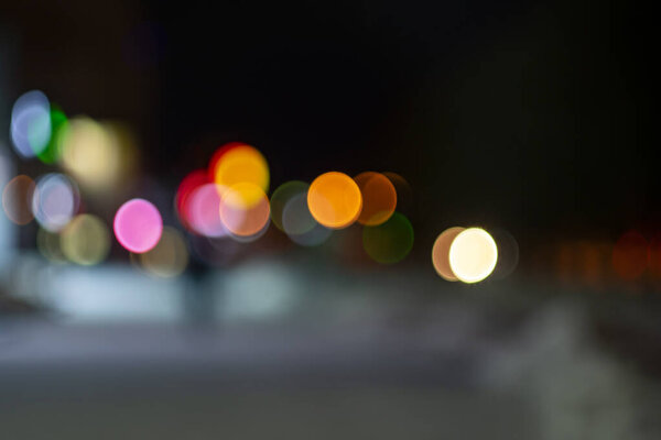 Night city lights. Blurred image with bokeh effect.