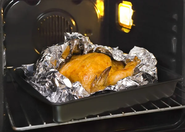 Juicy golden chicken in oven