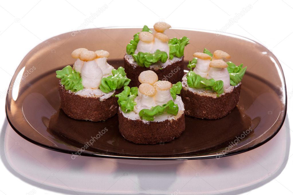 Some cakes on a plate on white background isolated