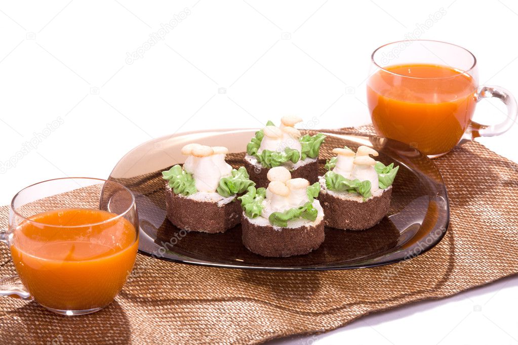 Two cake on plates with juice on white isolated
