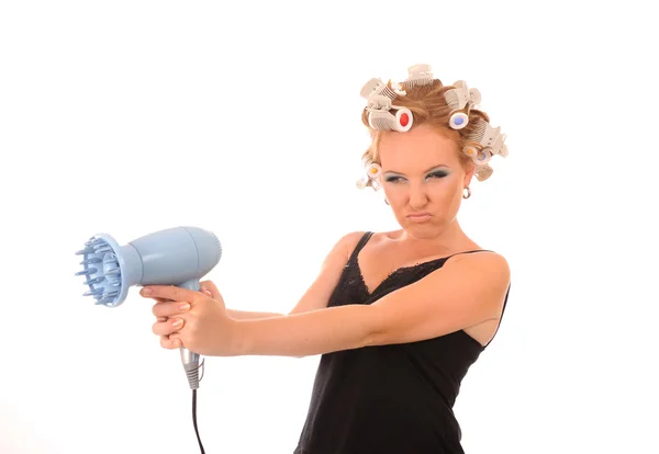 Femme au foyer tirer sur un sèche-cheveux — Photo