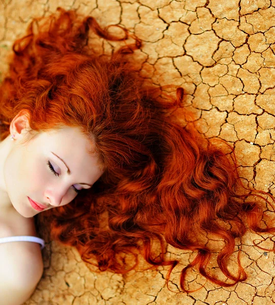 Woman on the dried up ground — Stock Photo, Image