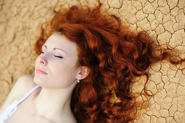 Woman on the dried up ground — Stock Photo, Image