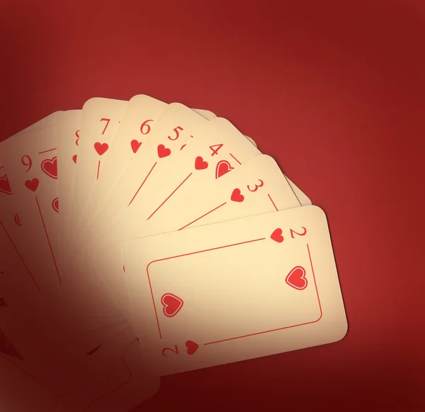 Spela kort på rött — Stockfoto