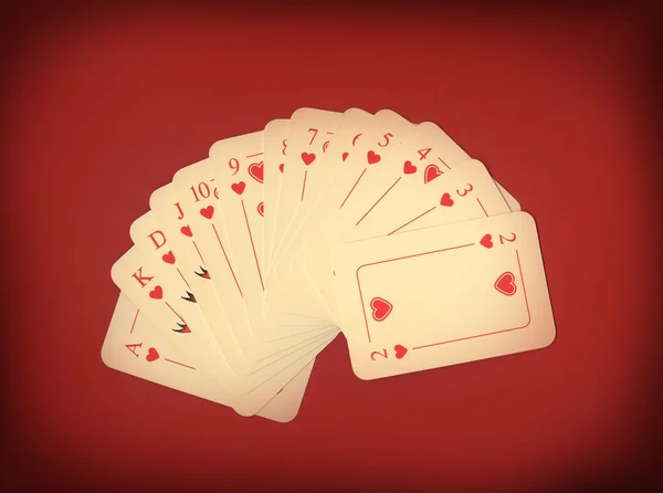 Spela kort på rött — Stockfoto