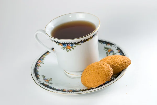 Taza de té y galletas aisladas — Foto de Stock