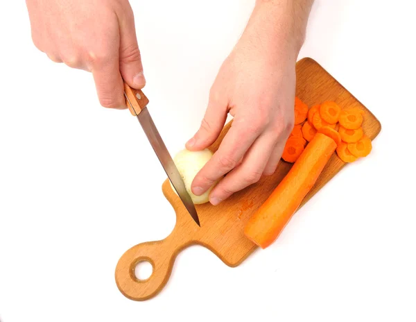 Male hand cutting onions and carrot — Stock Photo, Image