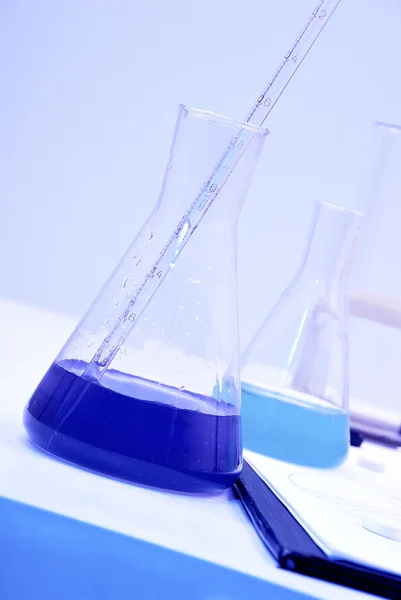 Glass test tubes filled with liquid — Stock Photo, Image