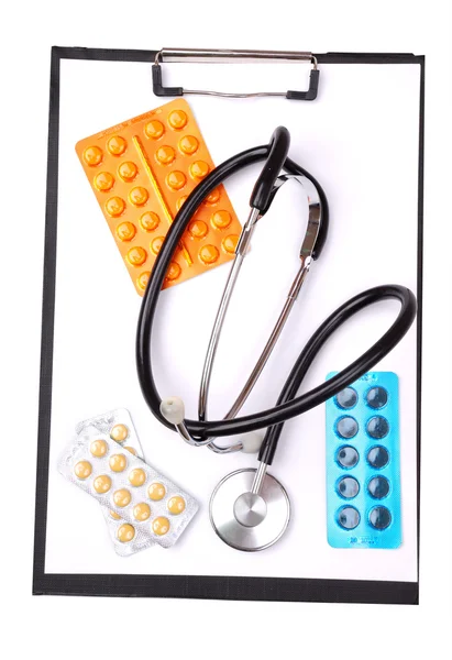 Medical clipboard, stethoscope and pills — Stock Photo, Image