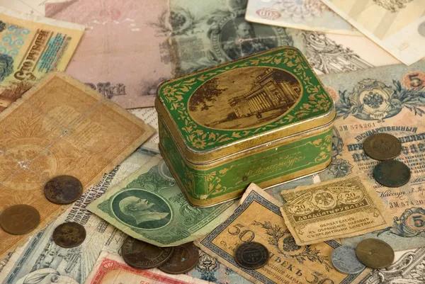 Background with old currency and box — Stock Photo, Image