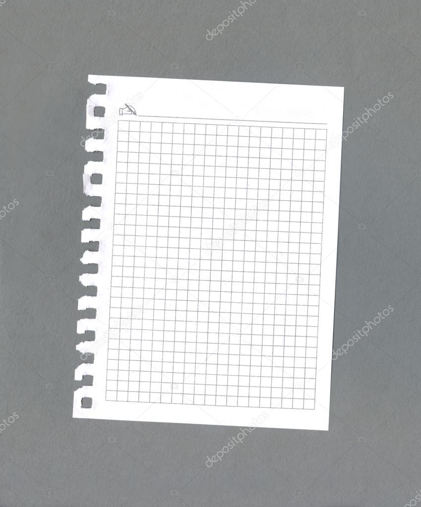paper from notepad on a grey
