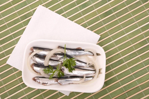 Salty fish with rings of an onions — Stock Photo, Image