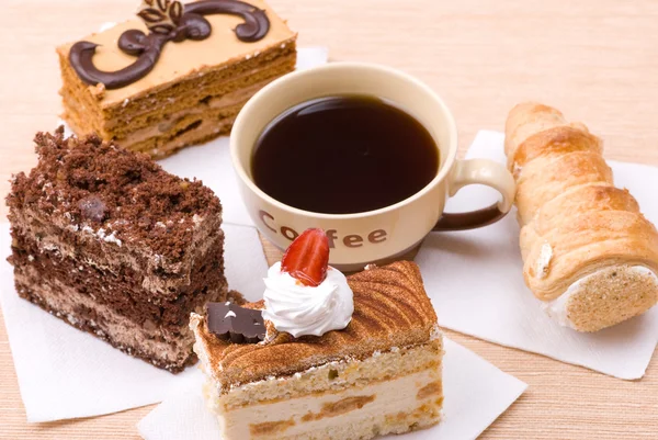 Cakes with cup of coffee — Stock Photo, Image