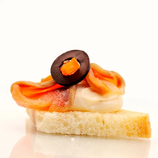 Sandwich with salmon, cream and olive — Stock Photo, Image