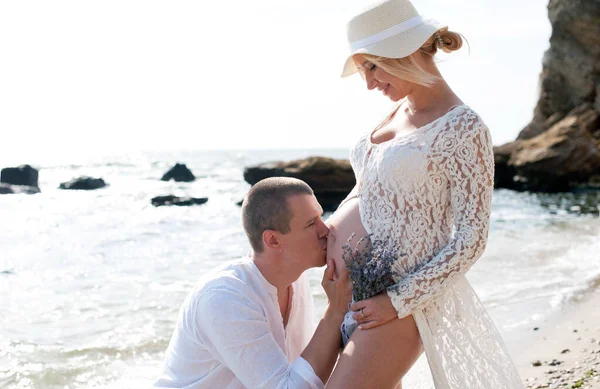 Happy Future Parents Couple Have Rest Sitting Sea Husband Kiss — стоковое фото