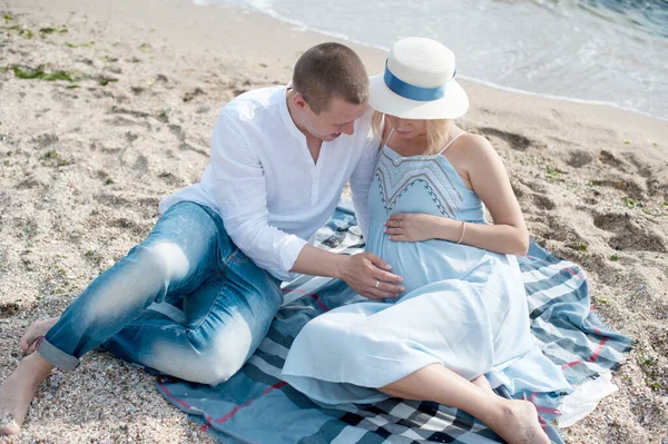 Happy Future Parents Couple Have Rest Sitting Sea Husband Hugs —  Fotos de Stock