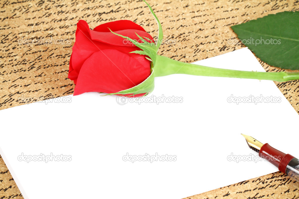 Red rose with a blank note