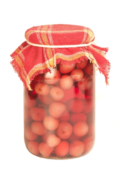 Jar of cherry on winter, isolated background — Stock Photo, Image