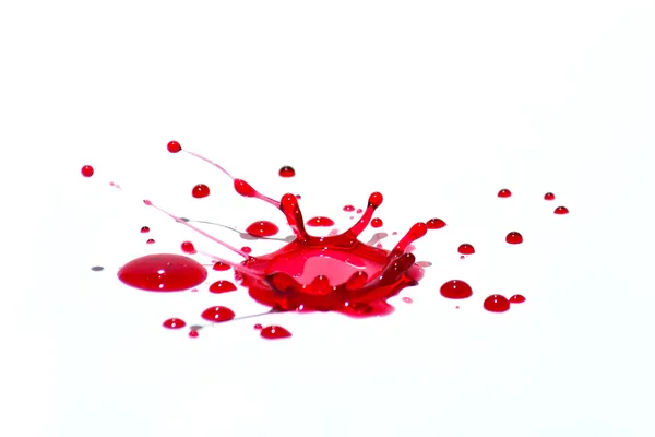 Glossy red liquid droplets (splatters) isolated on white — Stock Image Glossy red liquid droplets (splatters) isolated on white Royalty Free Stock Photos