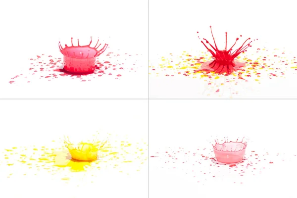 Red and yellow paint splashing on white. — Stock Photo, Image