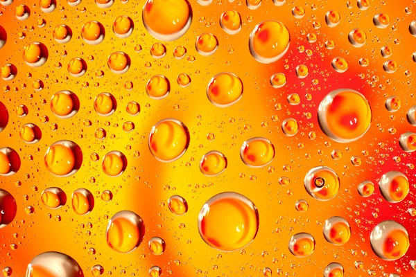 Water droplets as small lenses over a colored background. — Stock Photo, Image