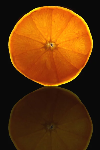 Orange slice on black background — Stock Photo, Image