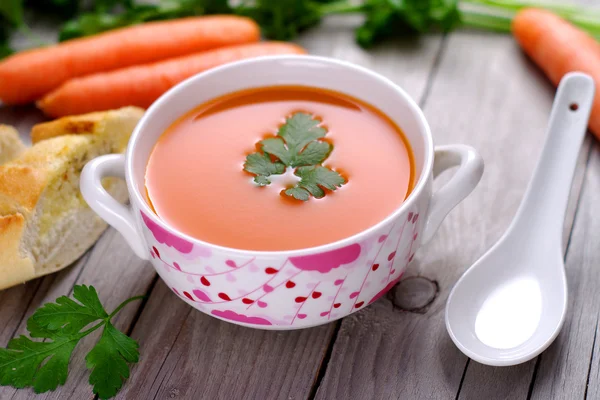 Carrot soup in a porcelain bowl. — Stock Photo, Image