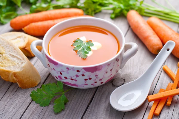 Carrot soup in a porcelain bowl. — Stock Photo, Image