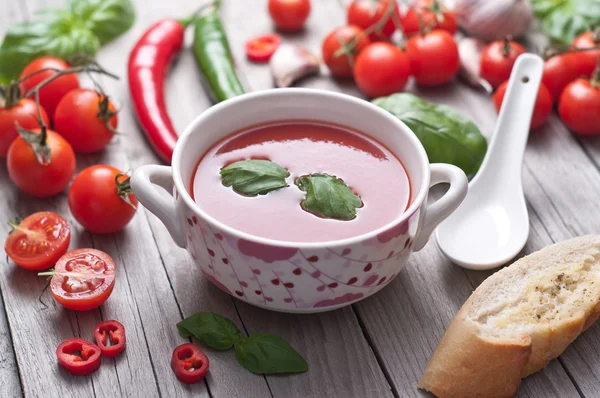 Fresh tomato soup in a porcelain bowl. — Stock Photo, Image